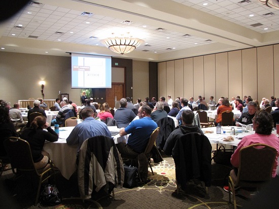 Audience listening to a presentation at a training event.